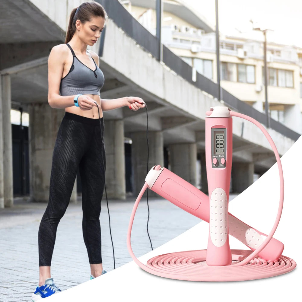 Woman training outdoors using digital fitness jump rope